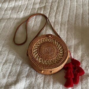 Round Straw Crossbody Bag with red tassel
